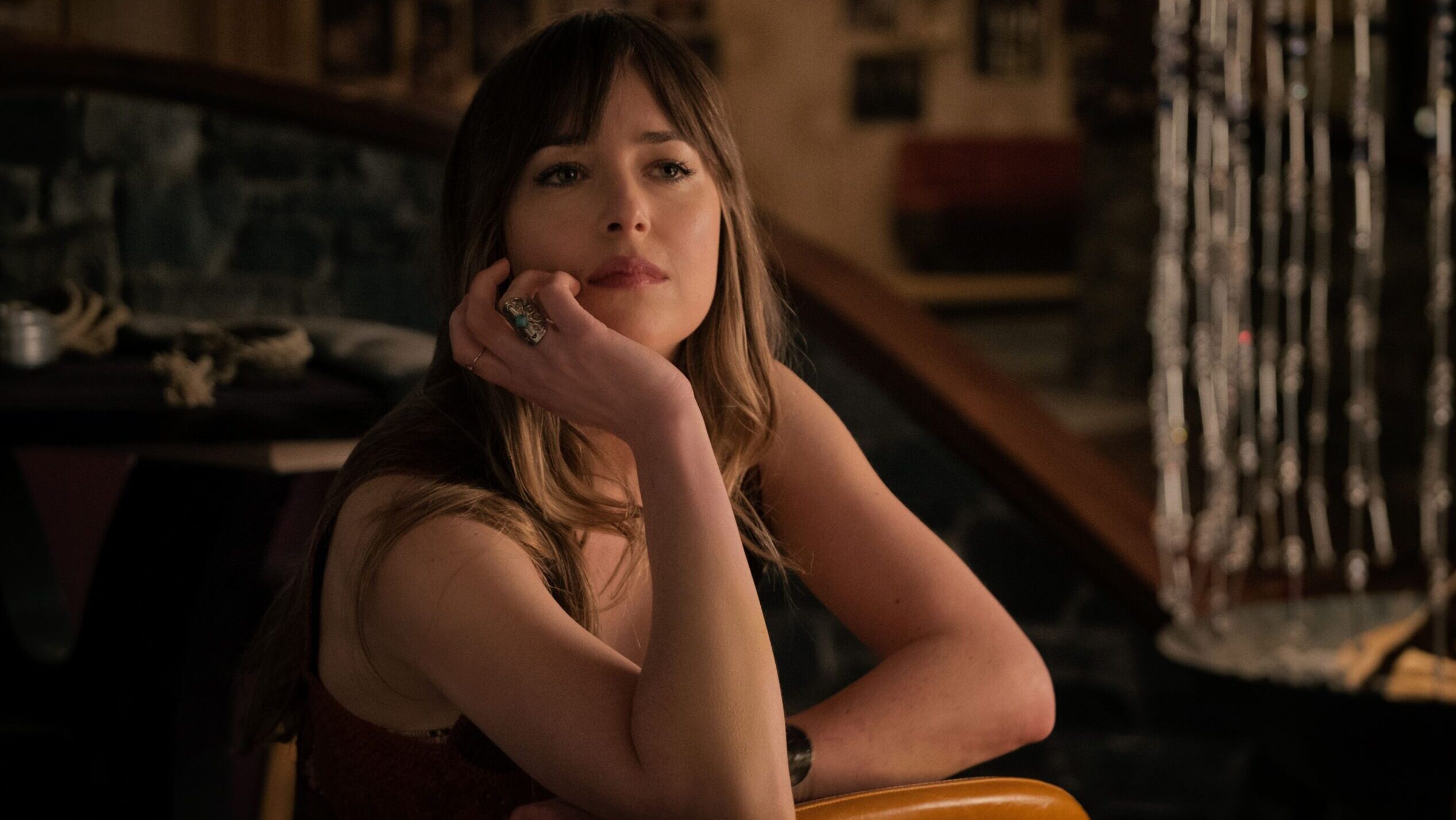 See Dakota Johnson Lounging In A Cozy Sweater And Nothing Else